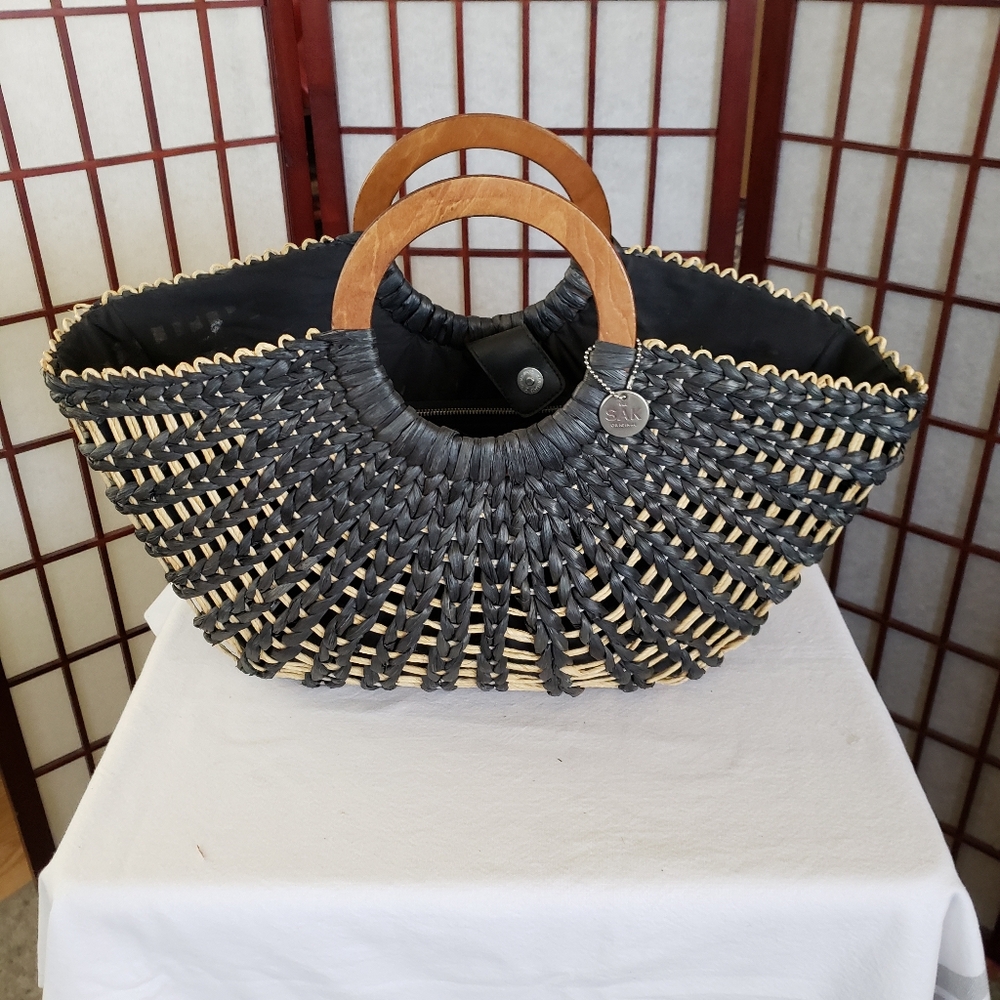 The Sak Woven Black and Tan Straw Tote with Wood Handles
